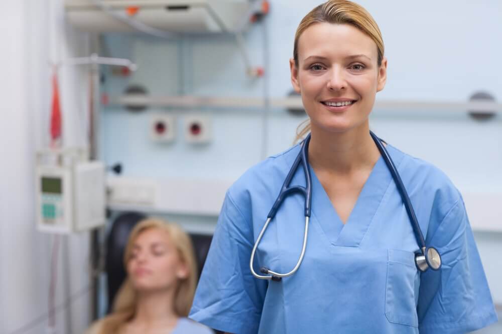 Nurse standing while looking at camera 